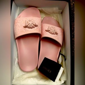Brand new Versace slides! Never worn and in perfect condition.